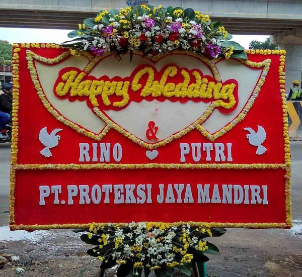 bunga papan happy wedding oleh rino dan putri dari pt proteksi jaya mandiri